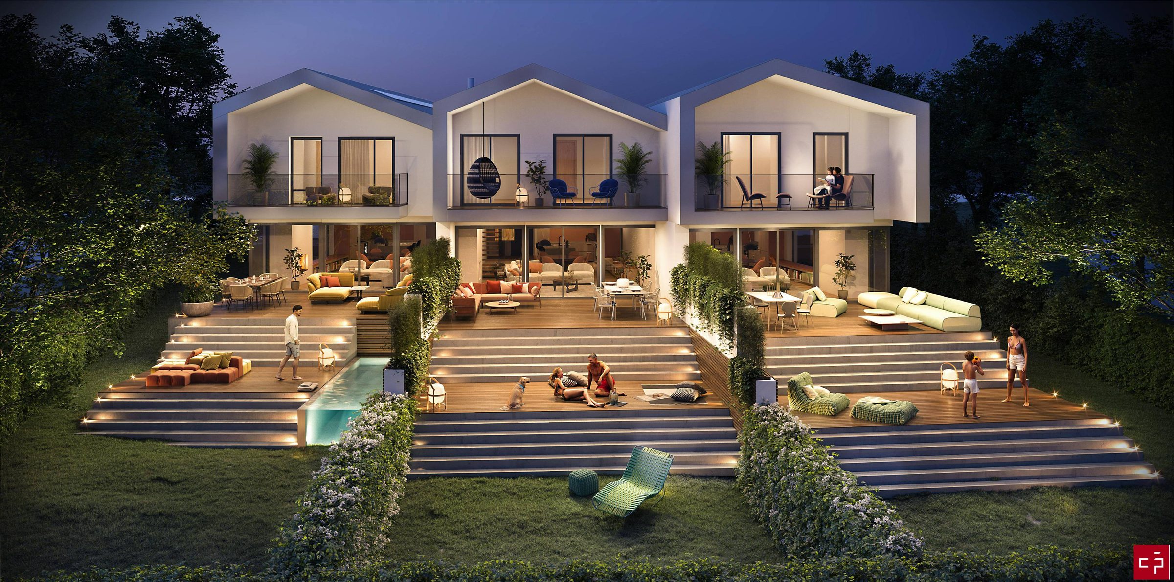 Les trois villas mitoyennes des Alvéoles vues depuis le jardin sud, à la tombée de la nuit, terrasses en gradins éclairées.
